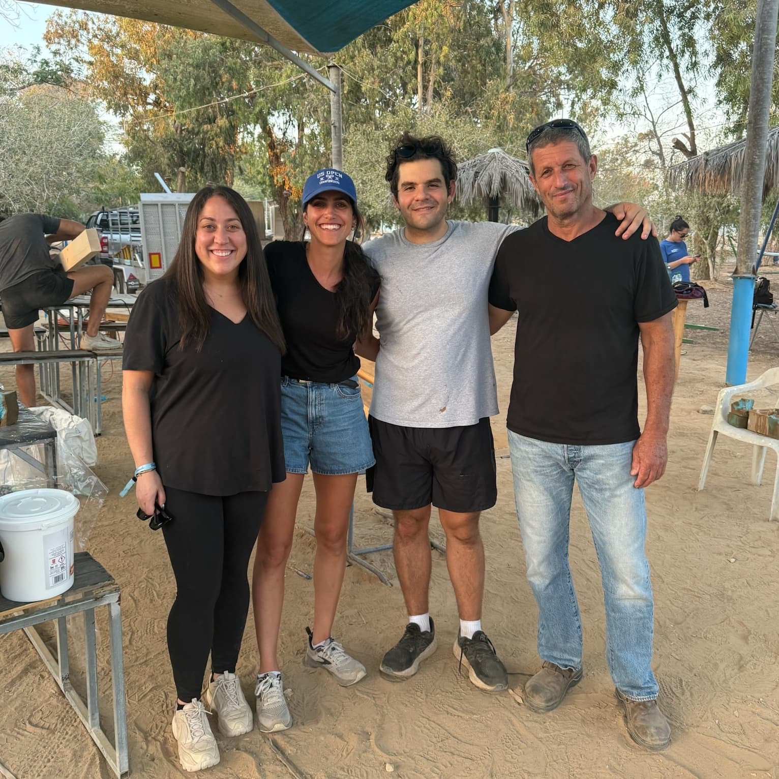 Four members of the Cactus Cafe rebuilding team standing together