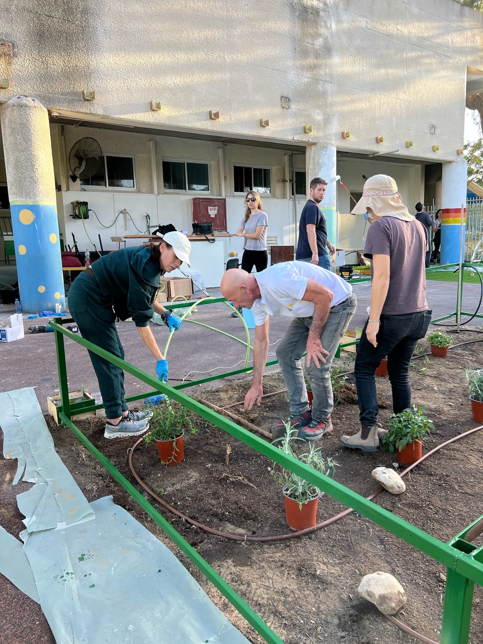 Volunteers rebuilding the kindergarten garden